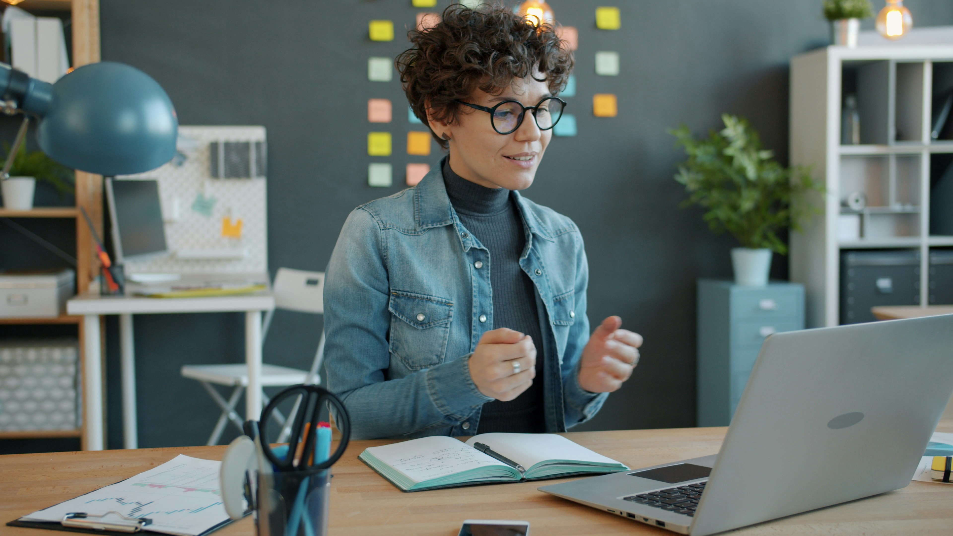 interos.ai employee collaborating over video from a home office